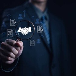 Business partnership concept with handshake icon under magnifying glass, symbolizing trust, agreement, corporate deal, and professional collaboration for growth and success. startup business